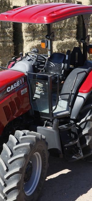 Case IH tractor with a red fiberglass canopy
